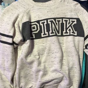 A sweater the brand is pink and the size XS